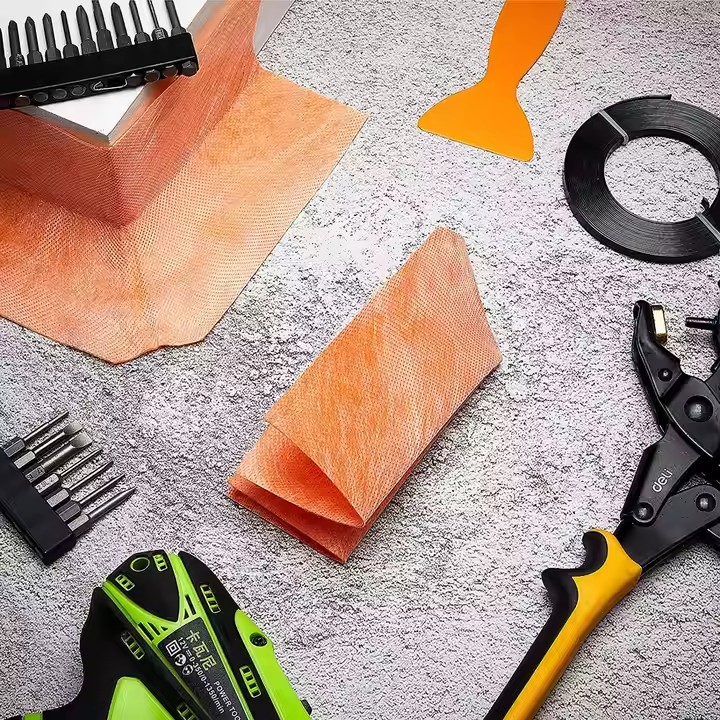 Orange shower corner waterproofing kit showcased with installation tools for DIY bathroom projects