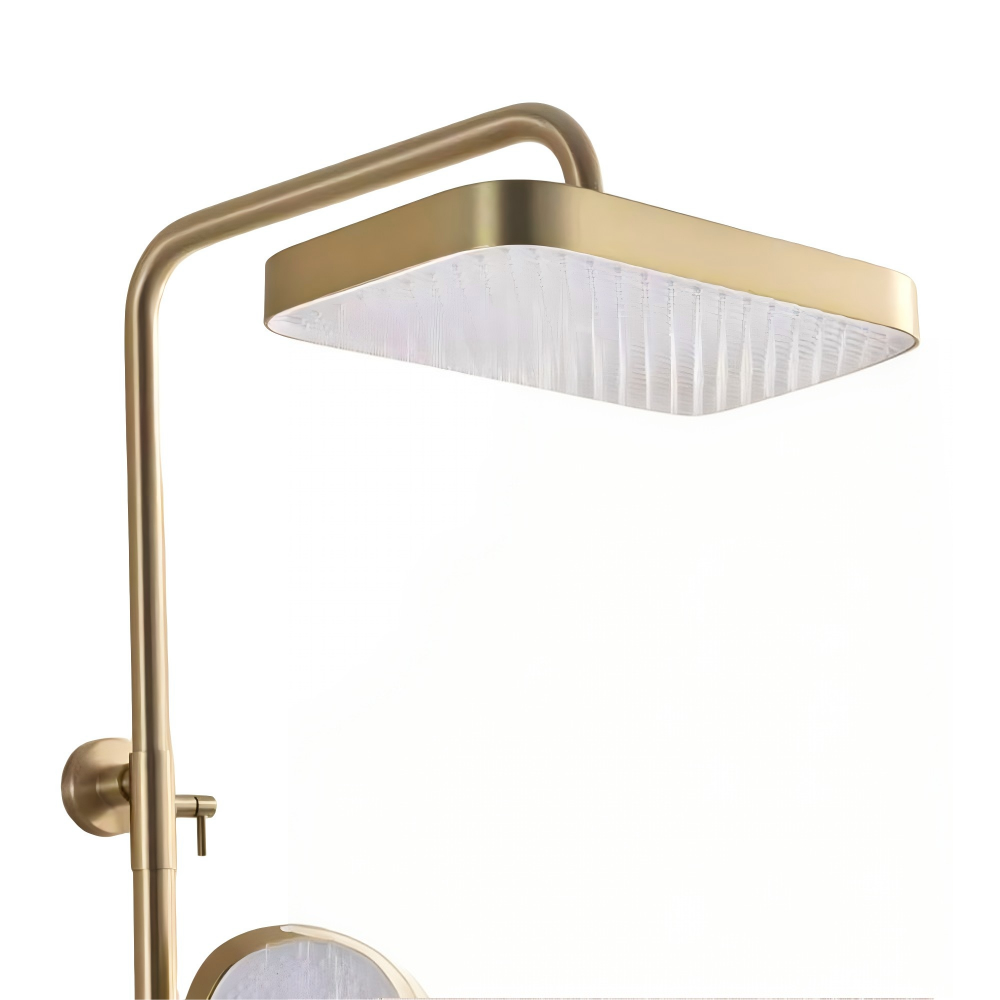 Square gold rainfall shower head close-up with wide water outlet