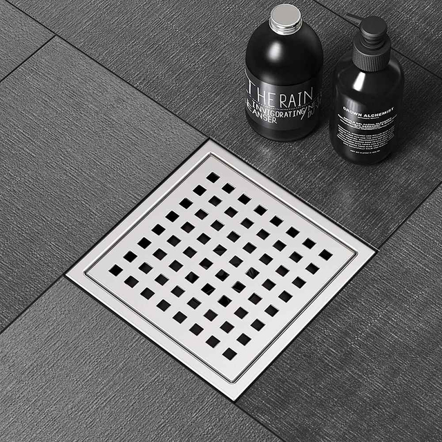 Drain square stainless shower drain applied on tiled bathroom floor