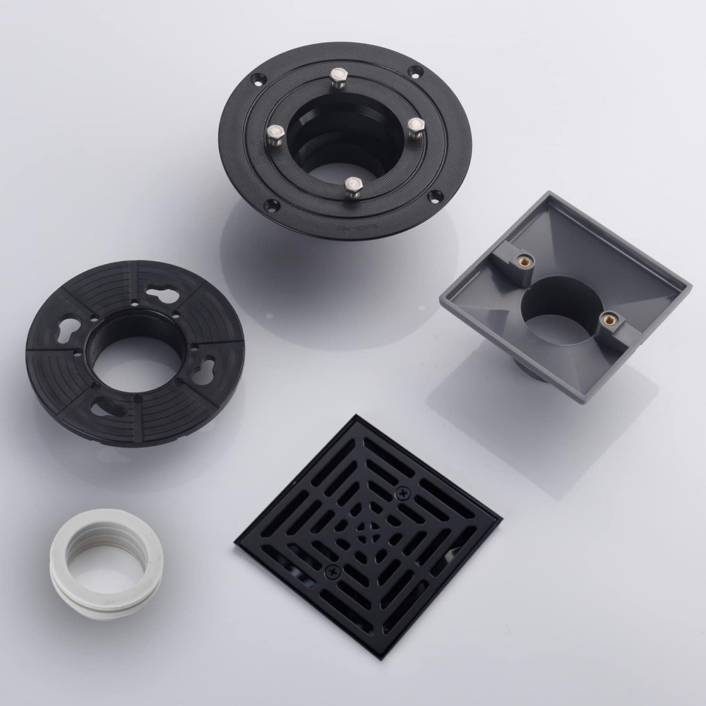 Disassembled components and hardware of the square black shower drain and vertical drains
