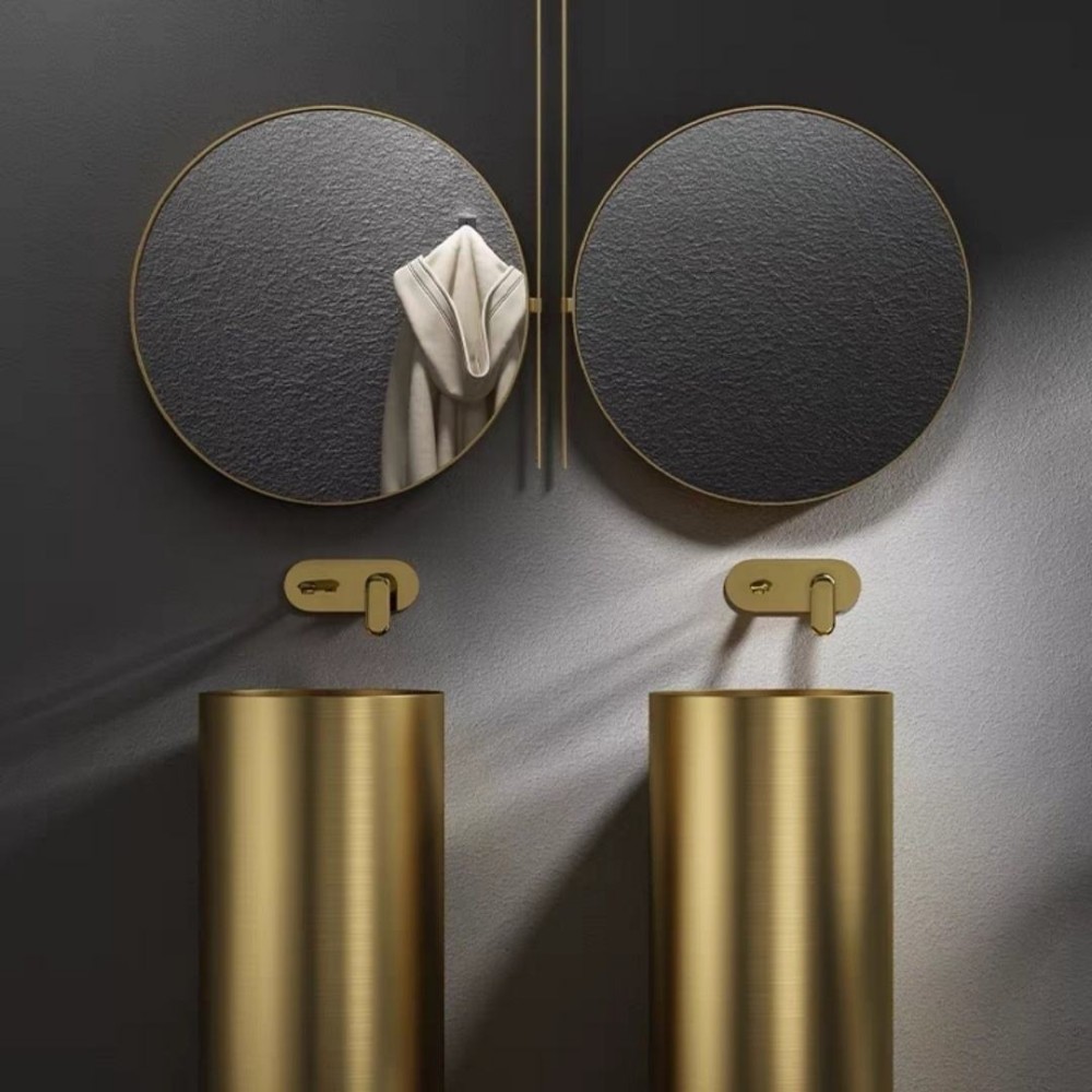 Round full pedestal wash basin in gold finish for luxury bathroom interior