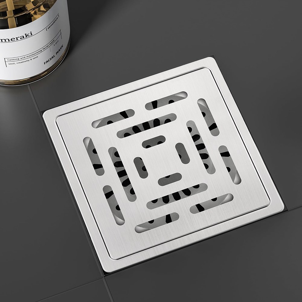 square dual outlet drain with stainless steel grate and concealed floor finish