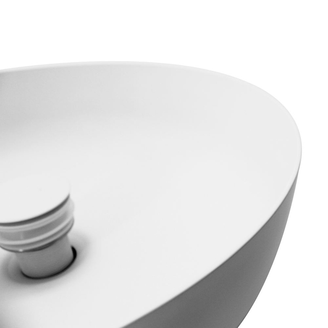 White round vessel sink stainless steel round sink close detail of rim and drain area