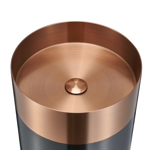 Round stainless steel wash basin interior detail with brushed copper finish