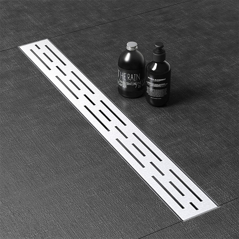 Adjustable support system for stainless steel channel drains
