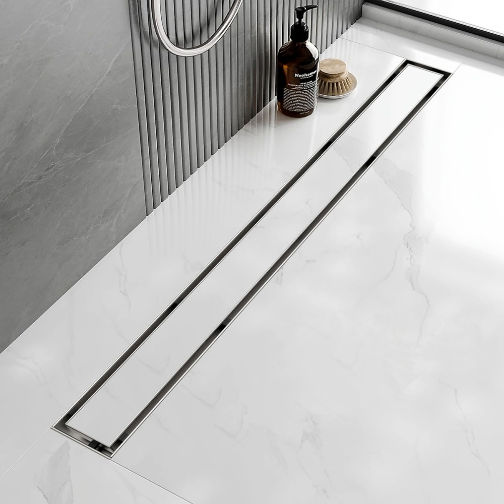 Modern bathroom installation of stainless steel invisible drain in marble floor