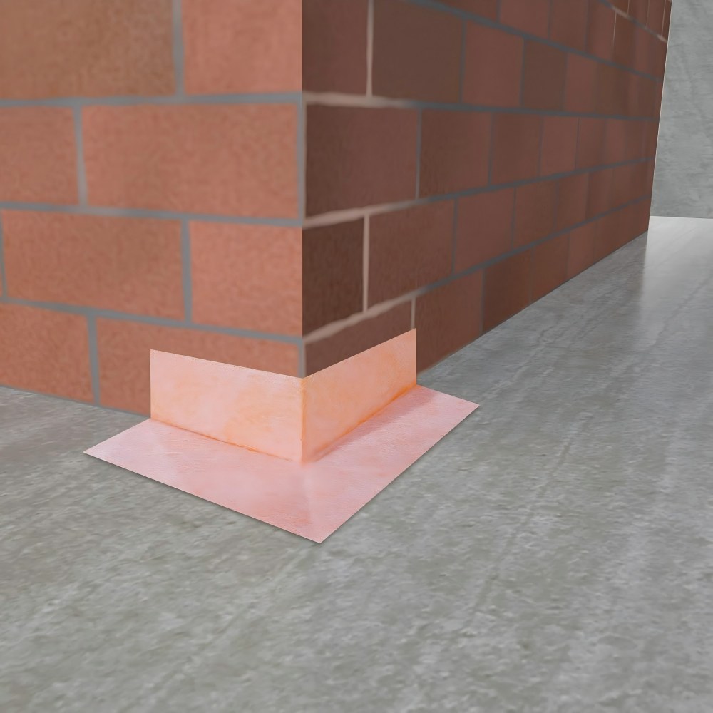 Structural-level bathroom corner waterproofing membrane installed at wall-floor joints