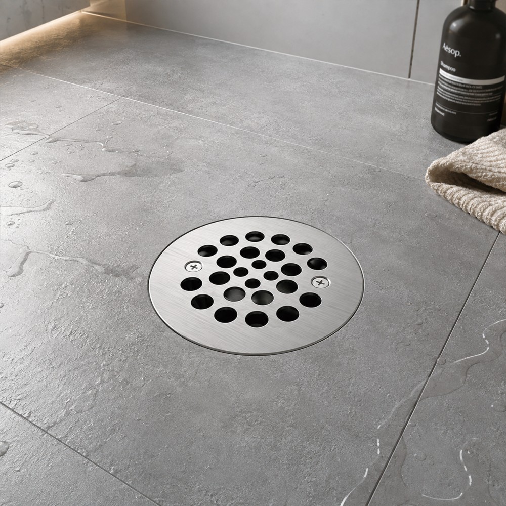 Seamless PVC round shower drain integration in wet tile shower area